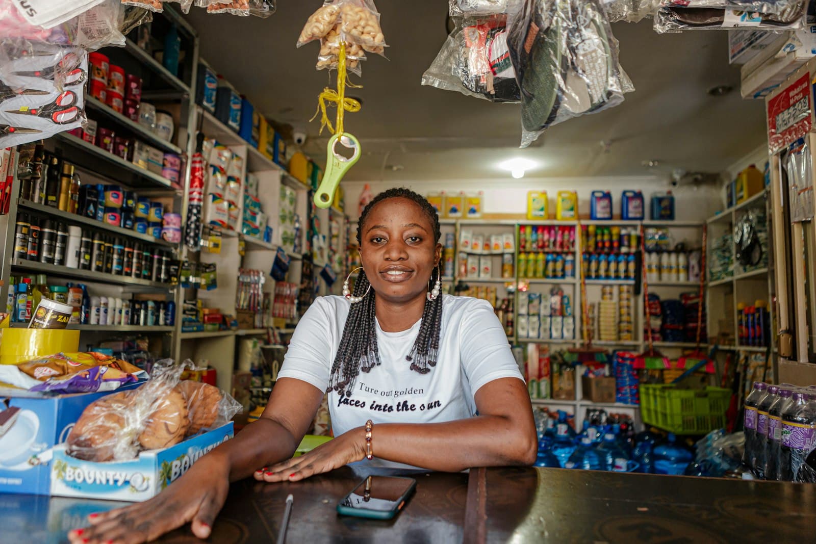 A shopkeeper at her counter