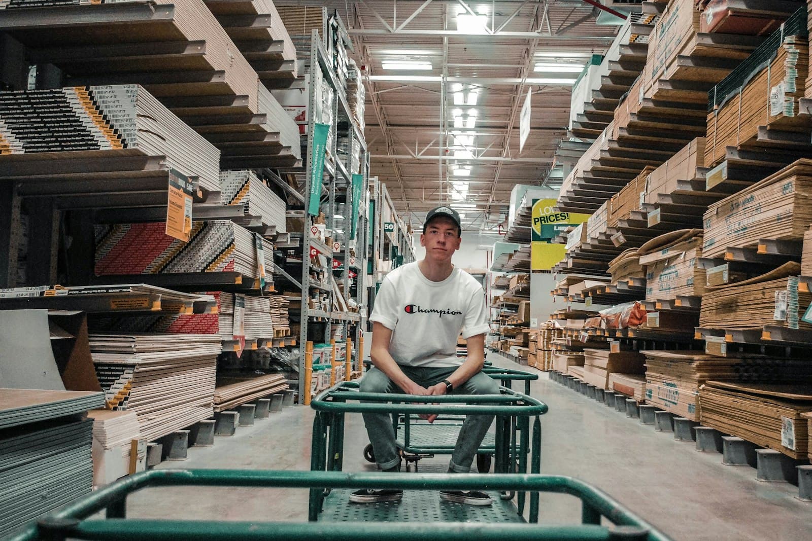 A worker moving boxes in a warehouse